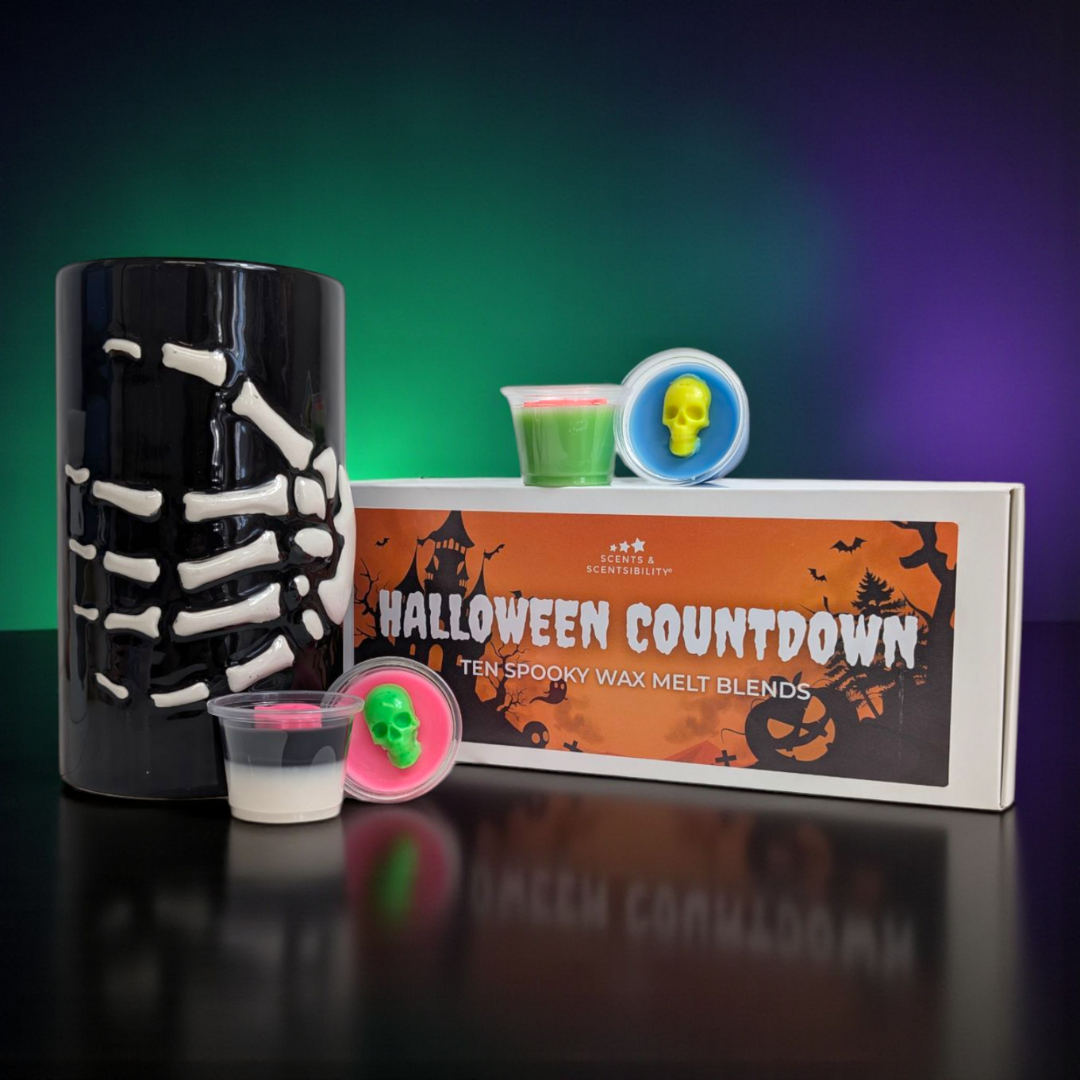Halloween-themed wax melt blends with a skeleton wax melt burner and decorative packaging.