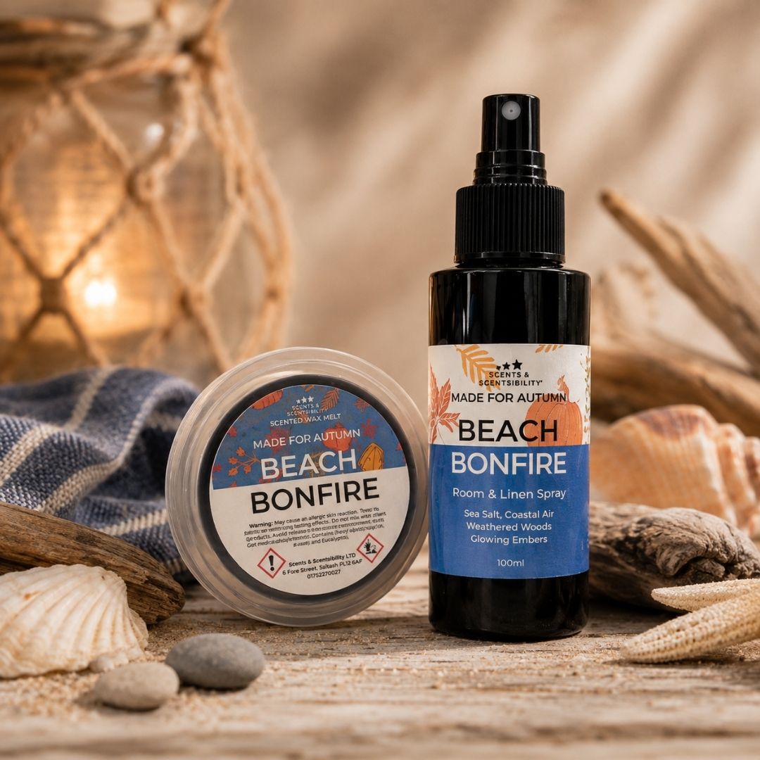 Made For Autumn Beach Bonfire Room & Linen Spray and scented wax melt styled together in a cosy coastal autumn setting with rustic wood and subtle seaside-inspired details.