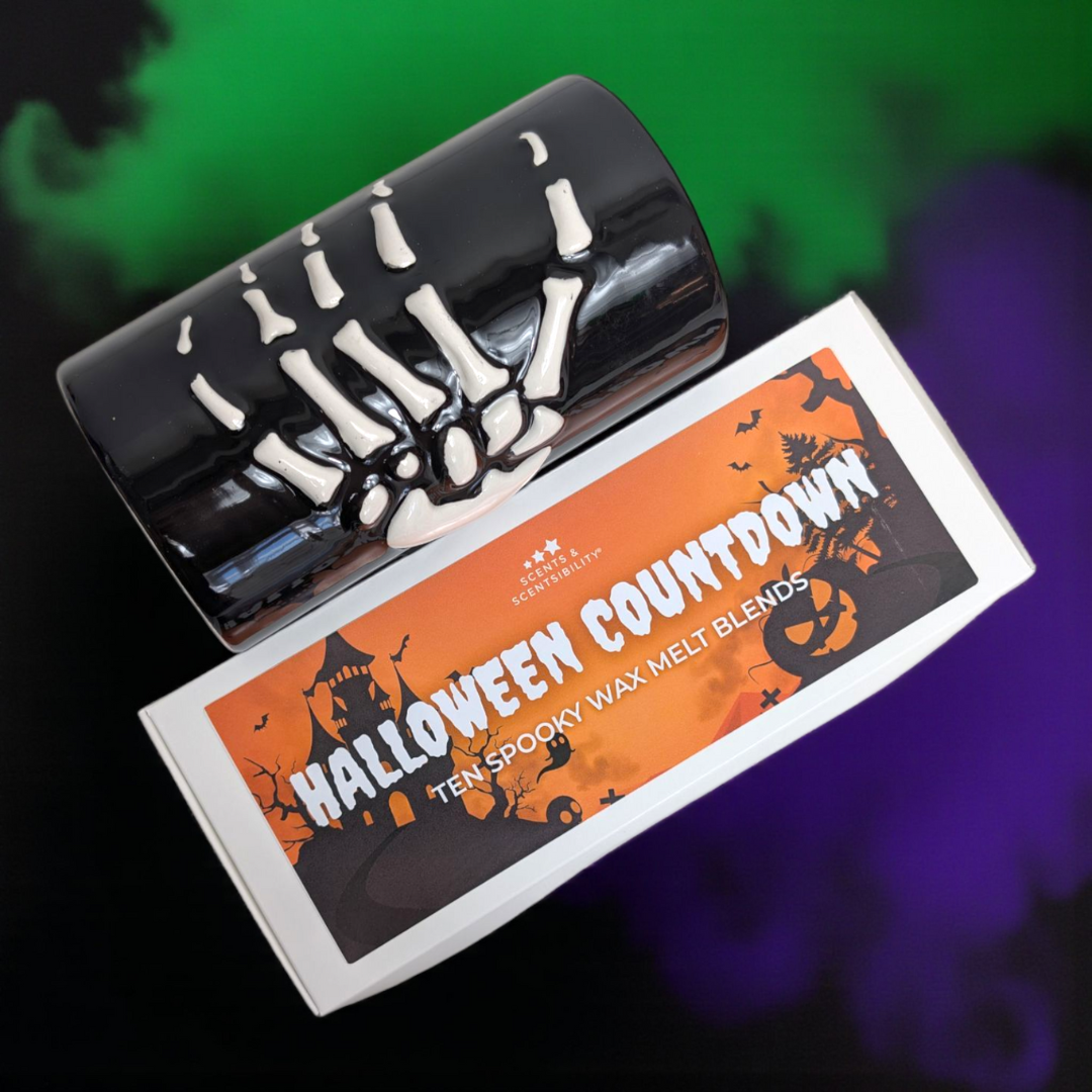 Halloween-themed wax melt blend packaging with skeleton design wax burner on a colorful background