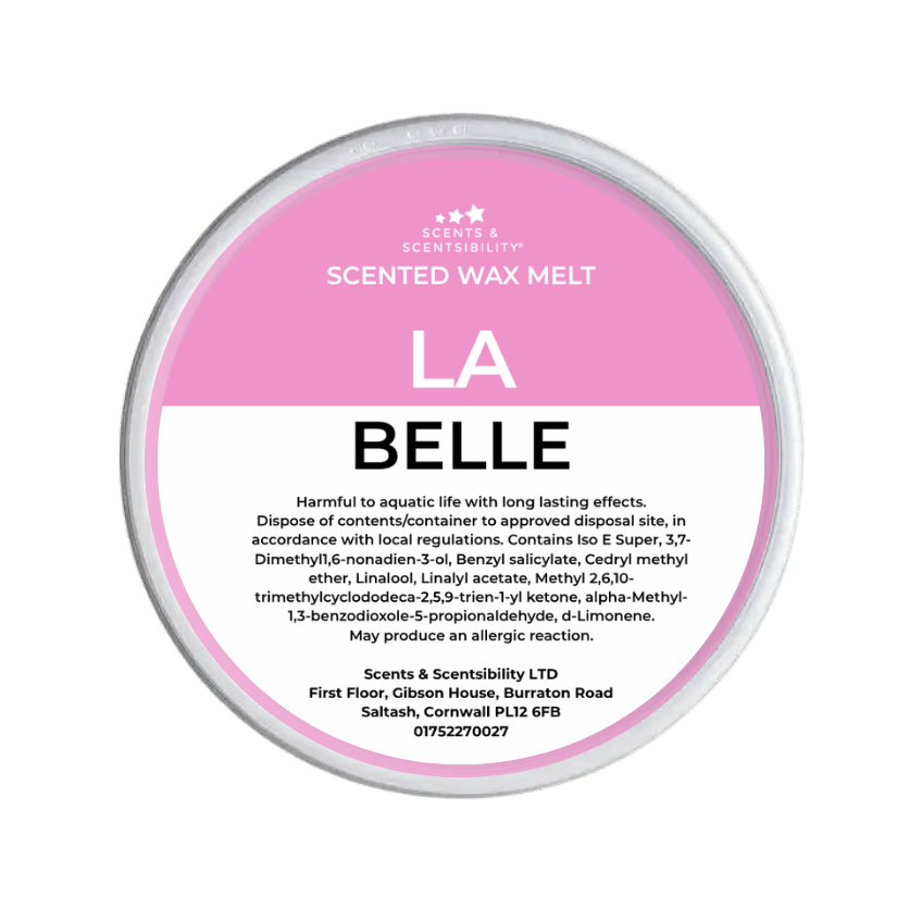 Scented wax melt container with pink label on a green background