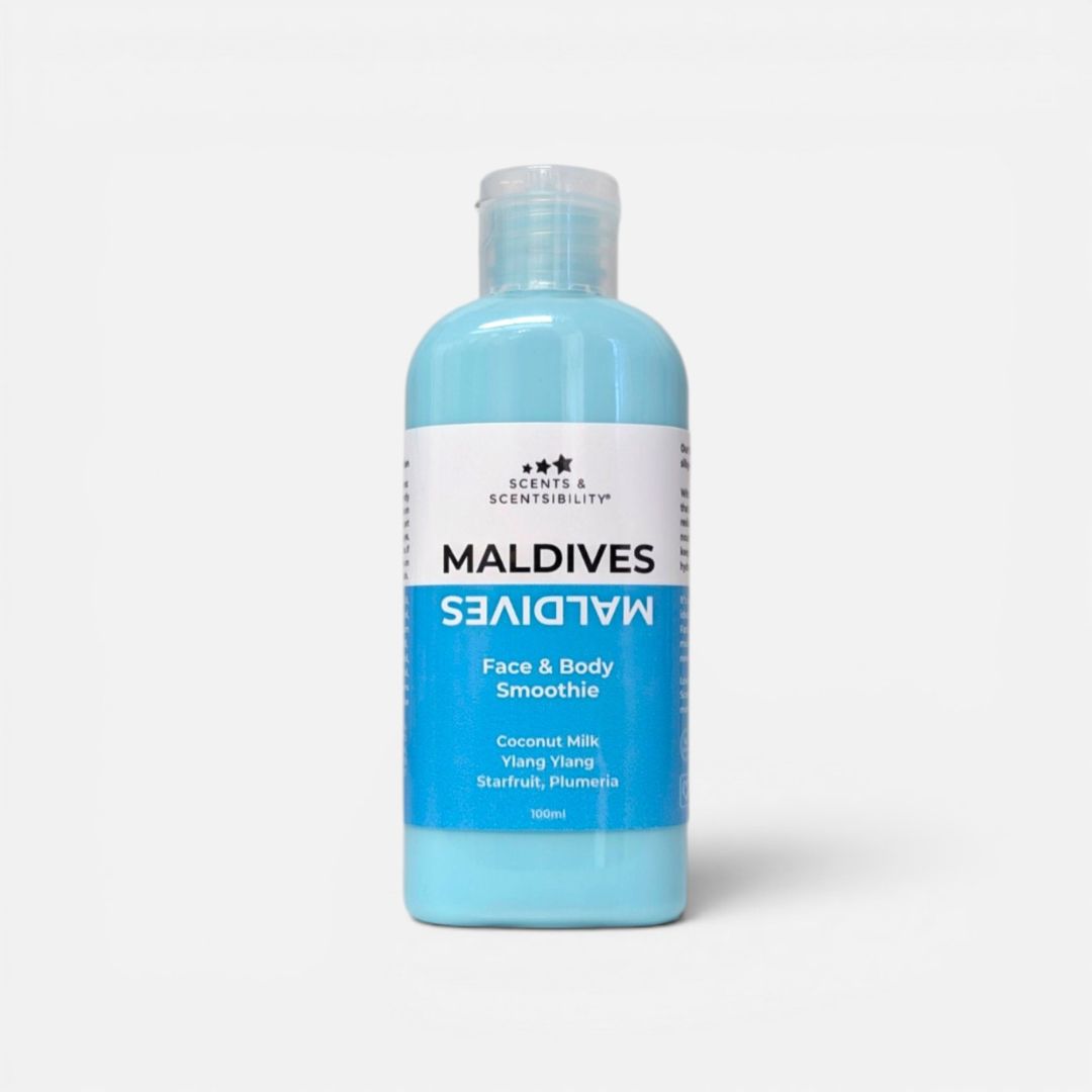 A bottle of Maldives Face & Body Smoothie Lotion in a light blue color, featuring a white and blue label, on a light gray background.