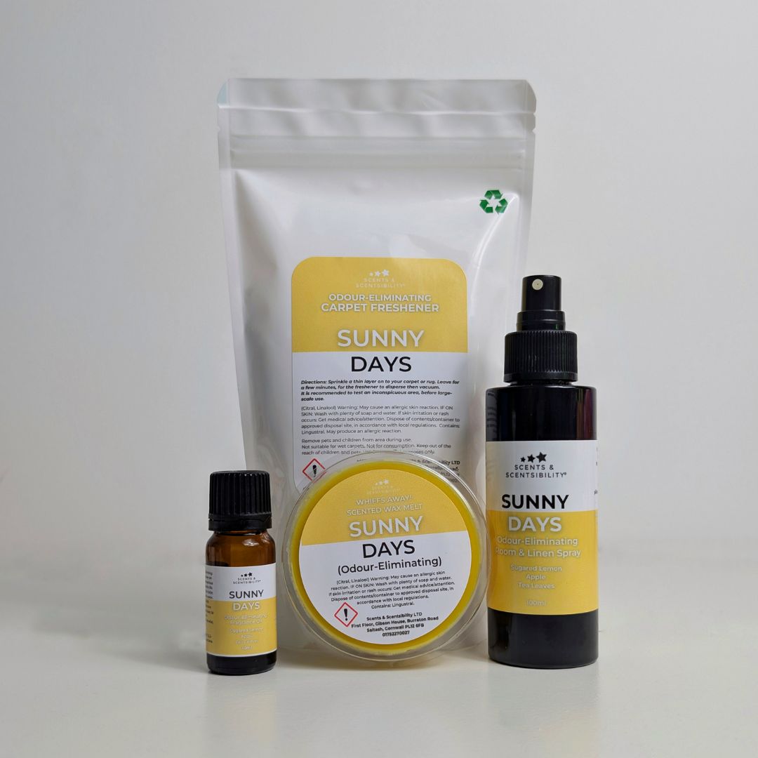 Collection of 'Sunny Days' products including a spray bottle, a bottle, a container, and a pouch on a light gray background.