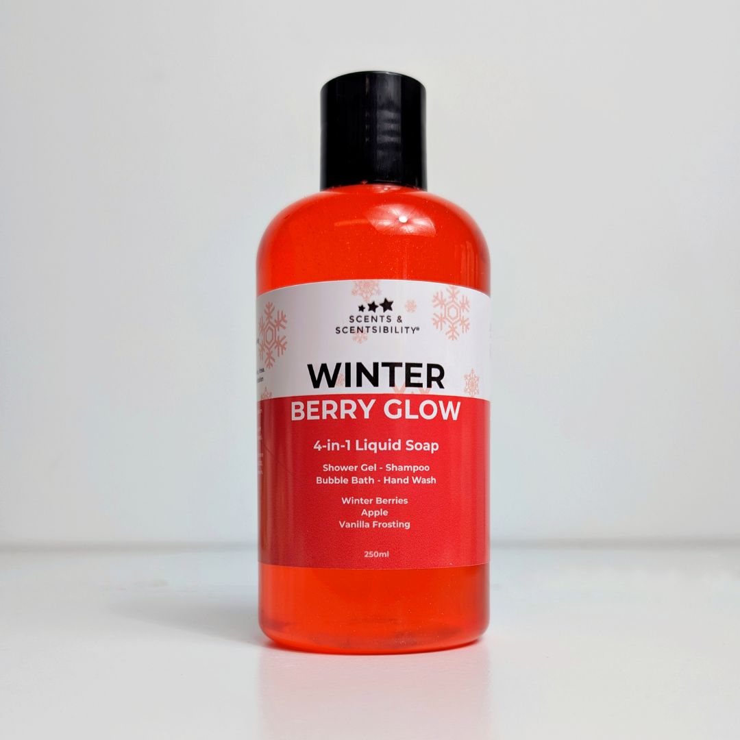 A bottle of red liquid soap with a red and white label saying Winter Berry Glow
