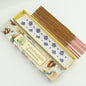 Incense sticks with their packaging on a white background