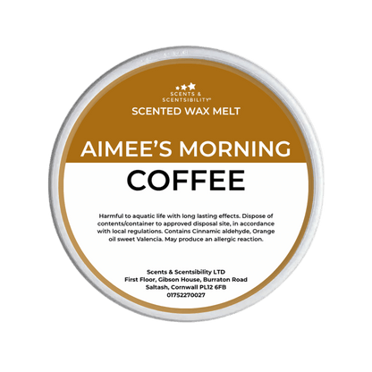 Scented wax melt container labeled 'Aimee's Morning Coffee' on a green background