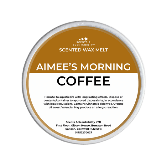 Scented wax melt container labeled 'Aimee's Morning Coffee' on a green background