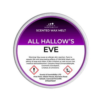 A round tub of Scents & Scentsibility 'All Hallow's Eve' scented wax melt, featuring a purple and white label with Halloween illustrations like ghosts, skulls, and a spiderweb.