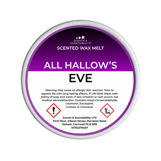 A round tub of Scents & Scentsibility 'All Hallow's Eve' scented wax melt, featuring a purple and white label with Halloween illustrations like ghosts, skulls, and a spiderweb.