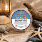 Made For Autumn Beach Bonfire scented wax melt in a cosy coastal autumn setting with natural wood, soft textures and subtle seaside-inspired details.