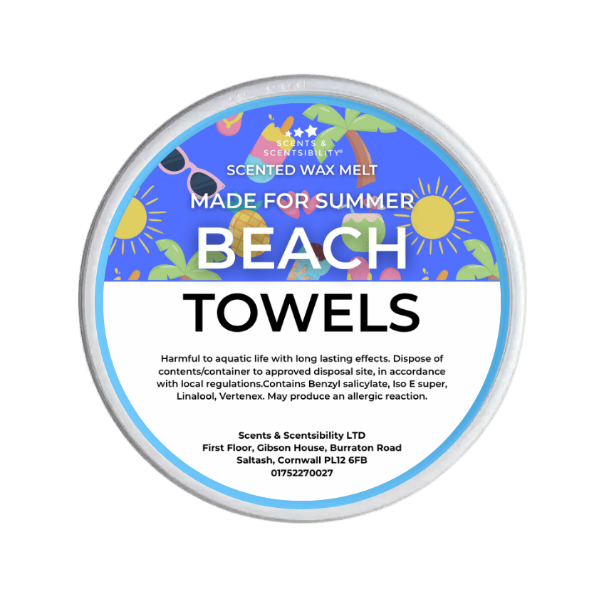 A round tub of Scents & Scentsibility 'Beach Towels' scented wax melt, featuring a colorful tropical beach-themed label on a white container, set against a solid dark green background.