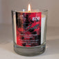 Scented candle with a red label featuring the brand 'BDB' on a neutral background