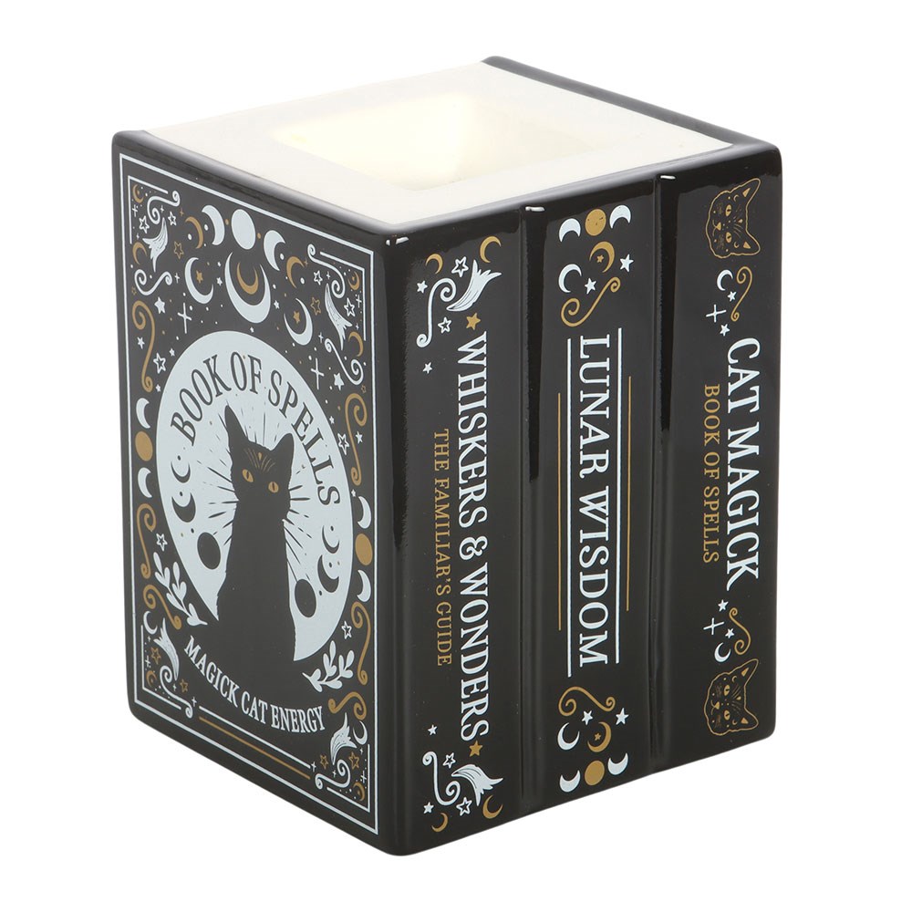Decorative book shaped cat-themed wax melt and oil burner on a white background