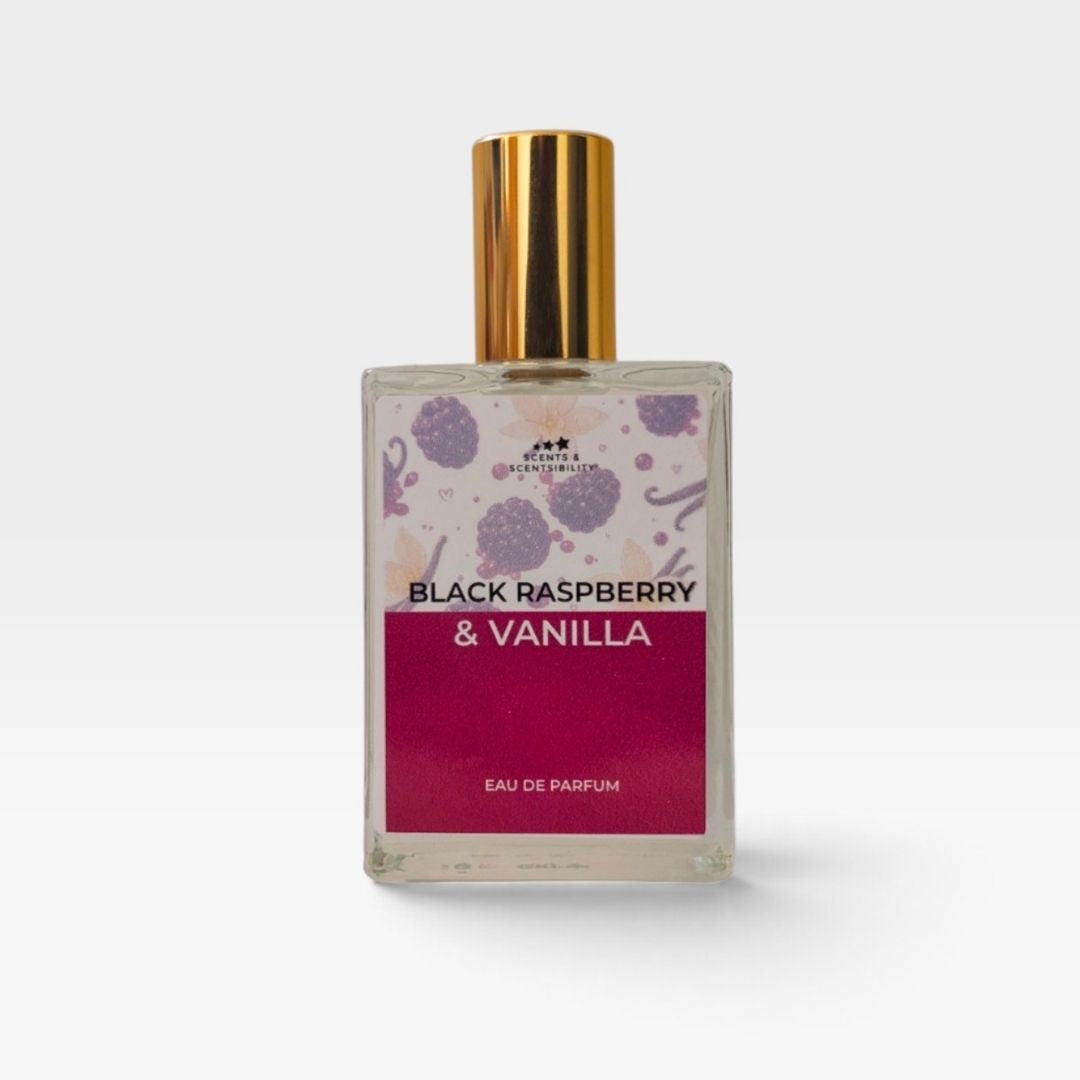 A bottle of perfume with a gold cap and dark red label with berries and vanilla, saying 'Black Raspberry & Vanilla'
