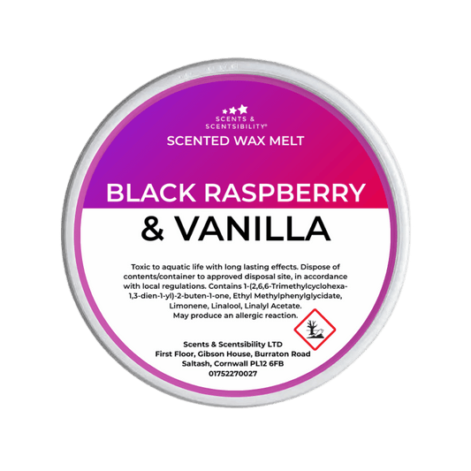 Scented wax melt container with 'Black Raspberry & Vanilla' label on a green background