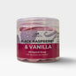 A jar of Scentis & Scentibility Black Raspberry & Vanilla Whipped Soap, showing the pink whipped soap inside a clear plastic jar with a white and dark red label.
