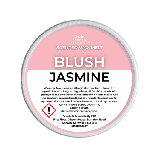 Scented wax melt container labeled 'Blush Jasmine' on a green background