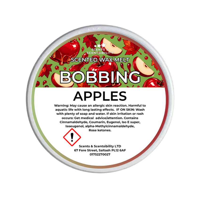 A round tub of Scents & Scentsibility Scented Wax Melt in the 'Bobbing Apples' fragrance, featuring a green and red apple-patterned label with a white warning panel at the bottom.