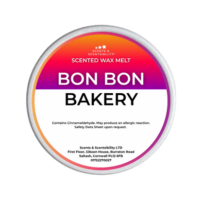 A Scents & Sensibility 'Bon Bon Bakery' scented wax melt, featuring a colorful gradient label with orange, pink, and purple hues on a solid dark green background.