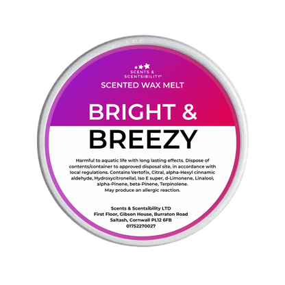 Scented wax melt container labeled 'Bright & Breezy' on a green background