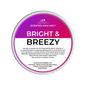 Scented wax melt container labeled 'Bright & Breezy' on a green background