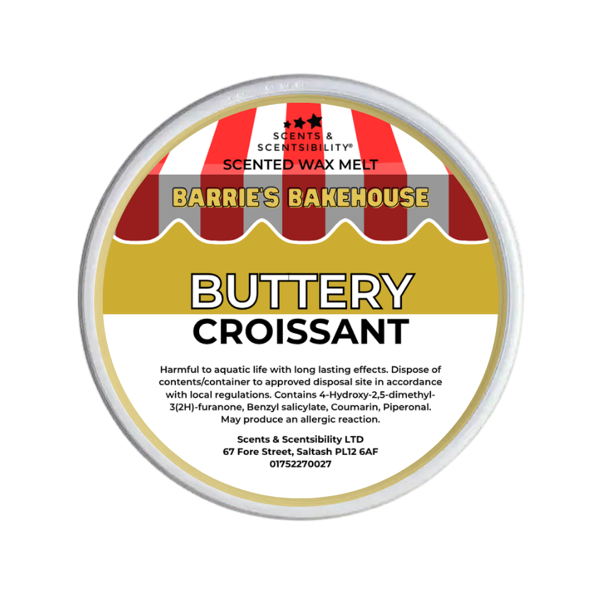 A round metal tub of Scents & Scentsibility 'Buttery Croissant' scented wax melt by Barrie's Bakehouse, featuring a label with red and white striped bakery awnings and yellow and white text.
