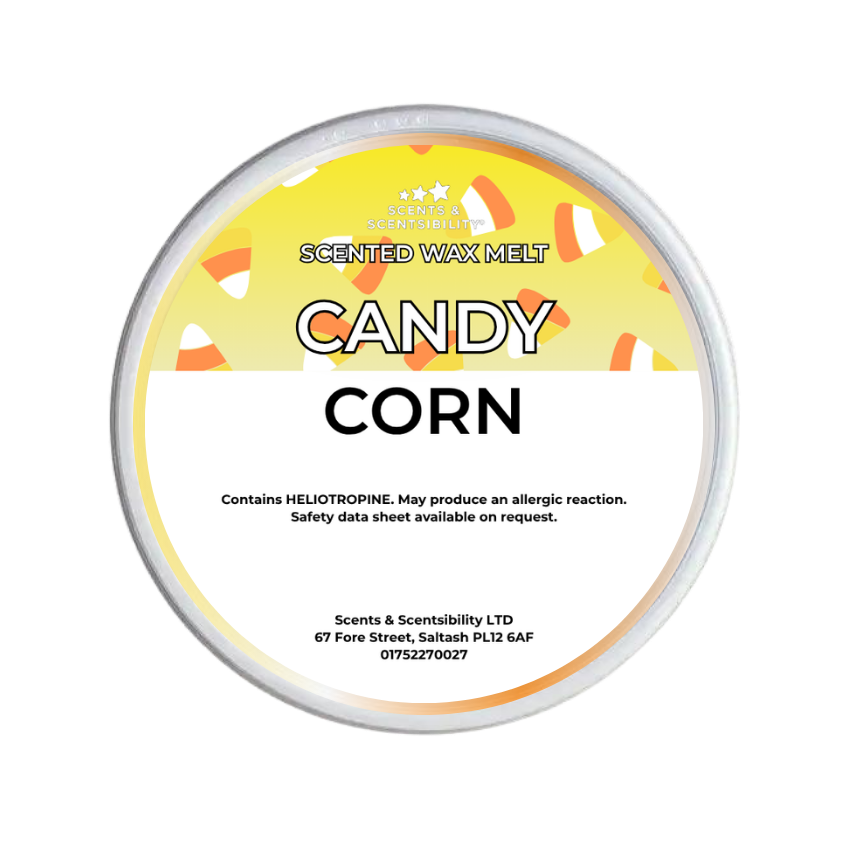 A round tin of Scents & Scentsibility 'Candy Corn' scented wax melt, featuring a yellow and white label with candy corn illustrations, on a solid white background.