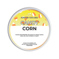 A round tin of Scents & Scentsibility 'Candy Corn' scented wax melt, featuring a yellow and white label with candy corn illustrations, on a solid white background.