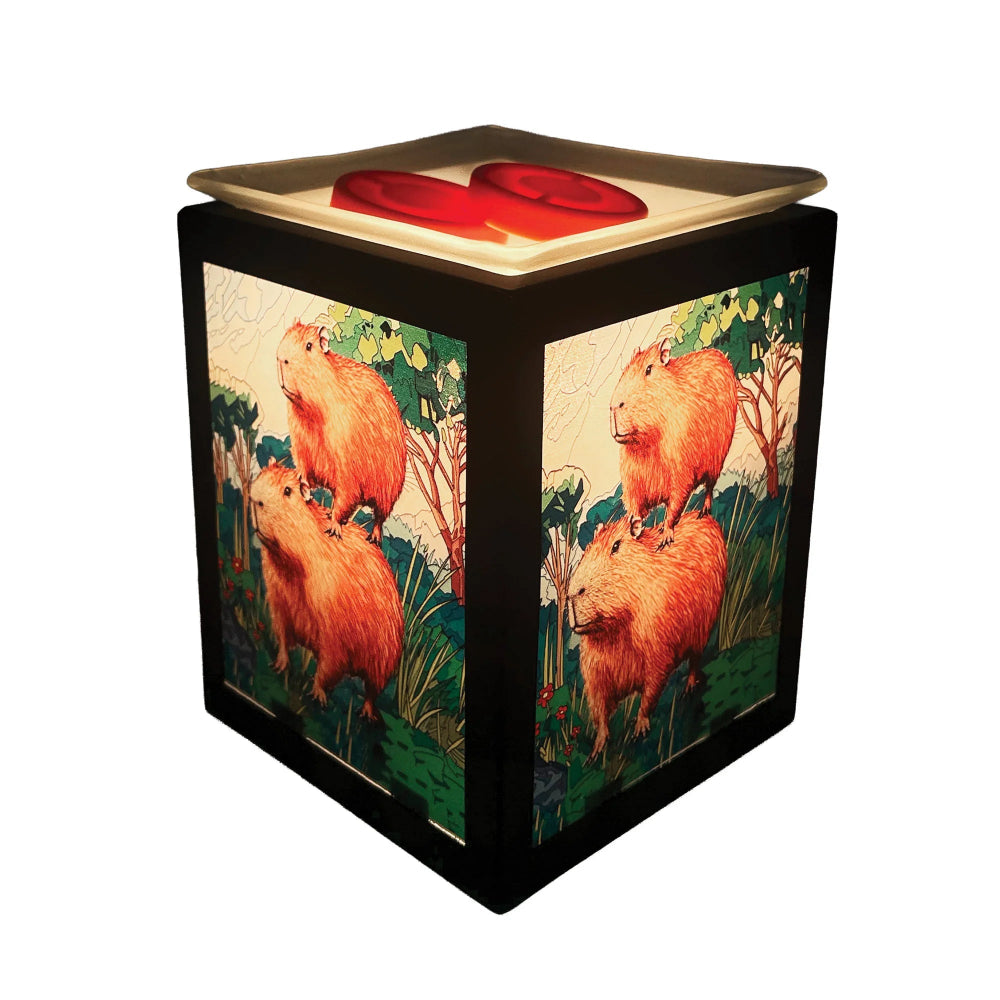 Cube-shaped wax melt warmer with capybara design on a white background