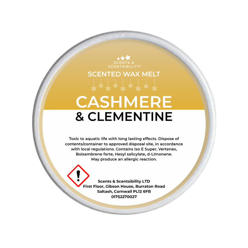 Scented wax melt container labeled 'Cashmere & Clementine' on a green background