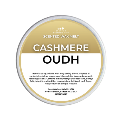 A round tub of Scents & Scentsibility Scented Wax Melt in the variant 'Cashmere Oudh'. The container features a white and gold label with black text, set against a clean white background.