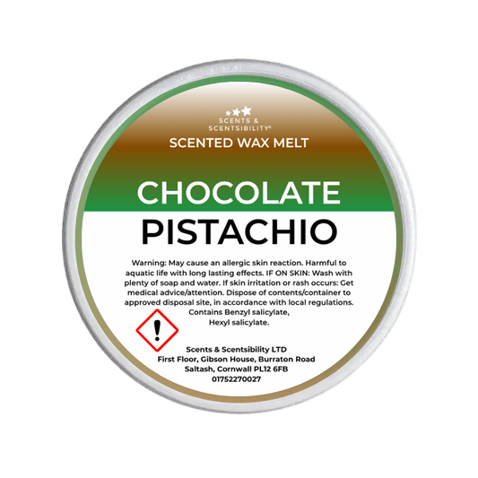 Scented wax melt container labeled 'Chocolate Pistachio' with branding and warning text on a green background.