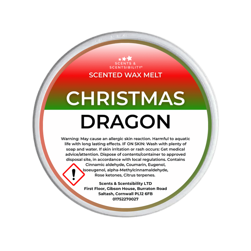 Scented wax melt container labeled 'Christmas Dragon' with warning information on a green background.