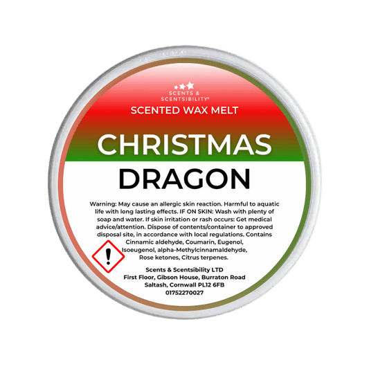 Scented wax melt container labeled 'Christmas Dragon' with warning information on a green background.