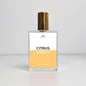 Perfume bottle labeled 'Citrus' on a light gray background