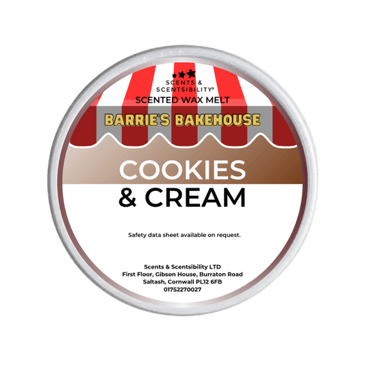 Scented wax melt container labeled 'Cookies & Cream' from Barrie's Bakehouse on a green background
