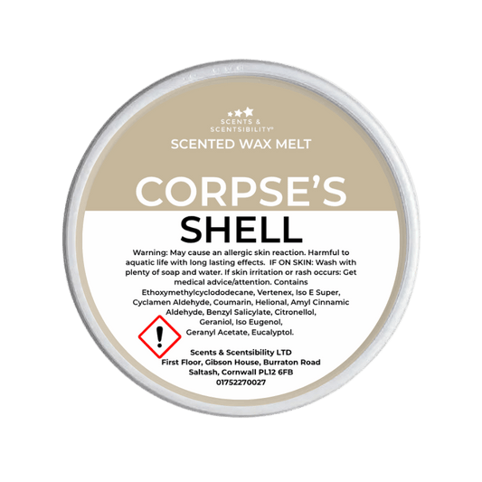 Scented wax melt container labeled 'Corpse's Shell' on a green background