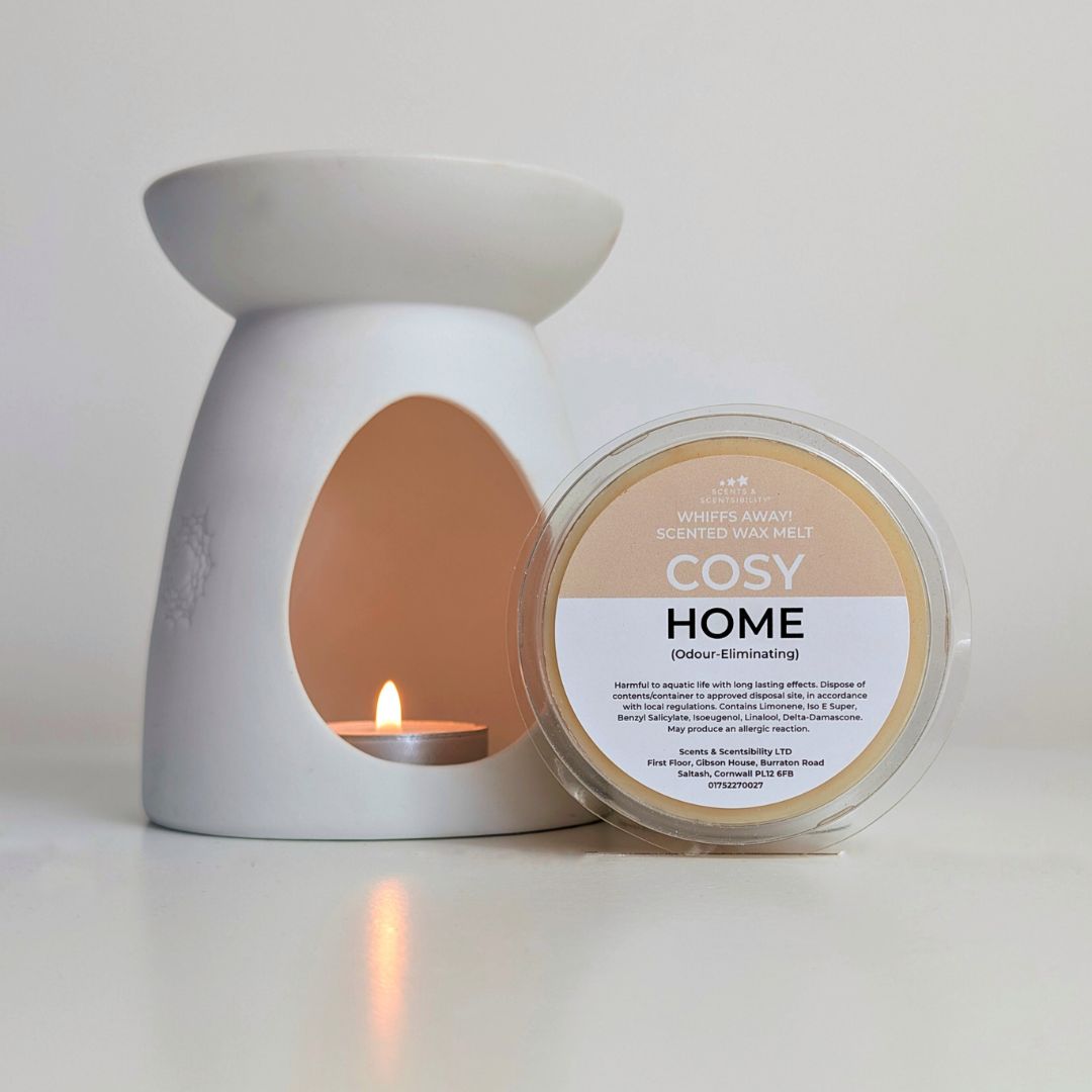 White wax melt warmer with a lit candle and a container labeled 'Cosy Home' on a white background