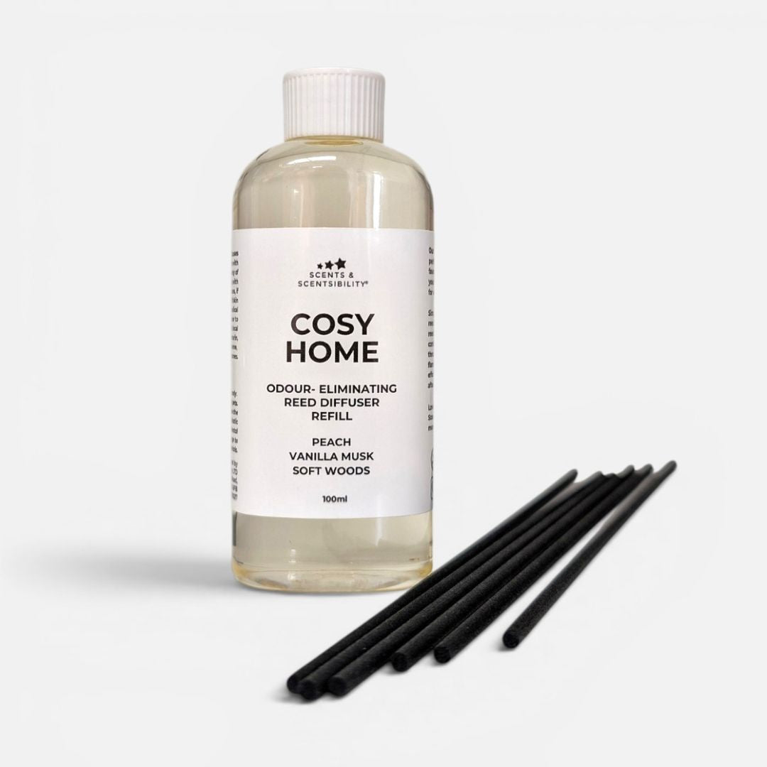 Cosy Home reed diffuser refill bottle with black sticks on a white background