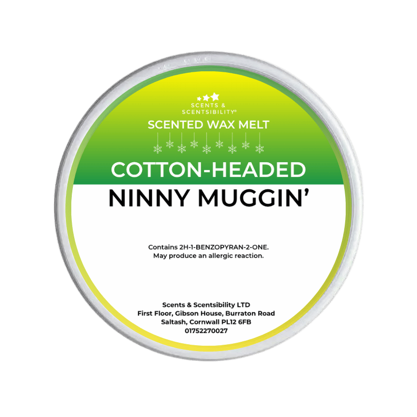 Scented wax melt container labeled 'Cotton-Headed Ninny Muggin' on a green background