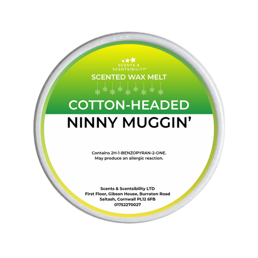 Scented wax melt container labeled 'Cotton-Headed Ninny Muggin' on a green background