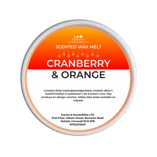 Cranberry & Orange scented wax melt container with branding on a green background