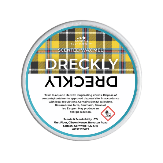 Dreckly scented wax melt packaging with Cornish Tartan on a green background