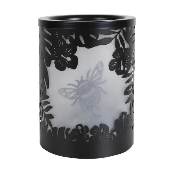 A black wax melt warmer unlit and bumble bee silhouette design on a white background