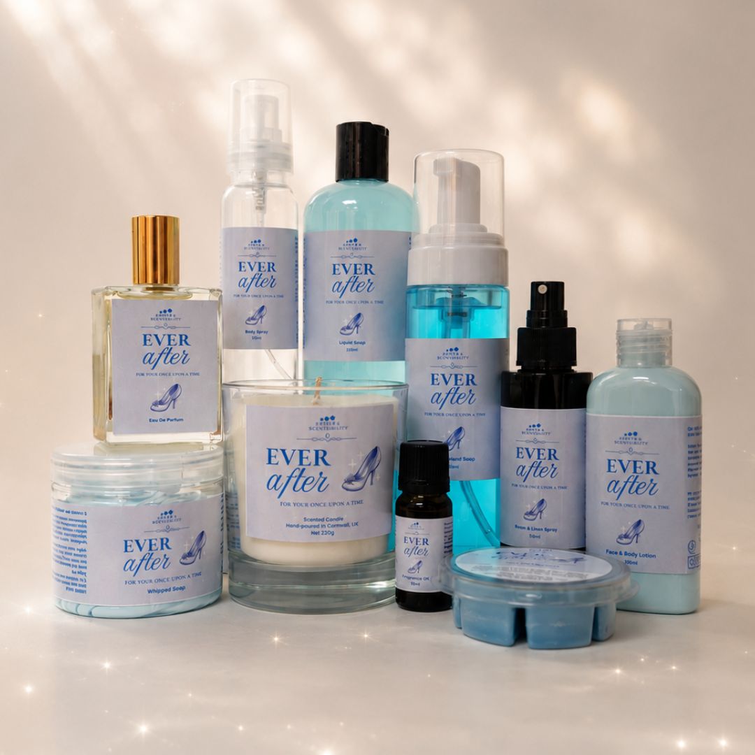 Collection of 'Ever After' skincare and beauty products on a reflective surface with a soft, blurred background.