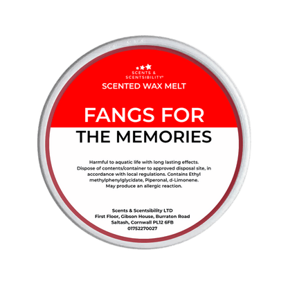 Scented wax melt container labeled 'Fangs for the Memories' on a red background