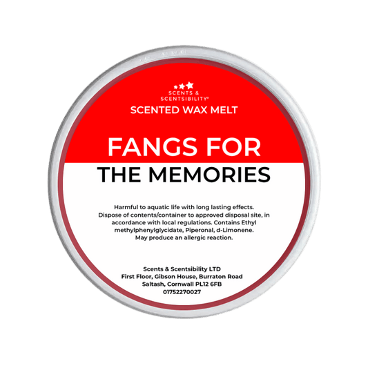 Scented wax melt container labeled 'Fangs for the Memories' on a red background
