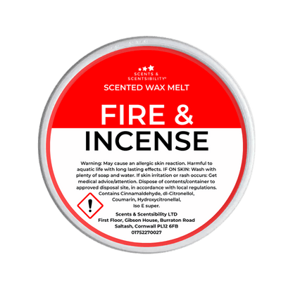 Scented wax melt container with red label on a green background