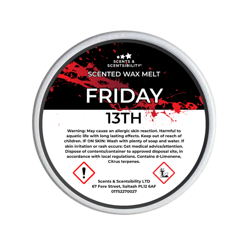 A round tin of Scents & Scentsibility Friday 13th Scented Wax Melt, featuring a black and white label with red blood-splatter graphics and hazard symbols.