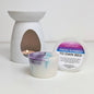 Scented wax melt container, wax melt, and diffuser on a white background