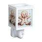 A white plug in wax melt warmer, featuring a festive gingerbread man design
